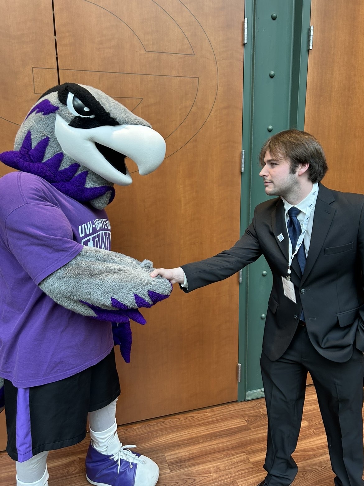 Ryan Hoke greeting the UW-Whitewater Warhawk mascot